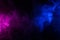 Waves of neon swirling blue and purple smoke dark background