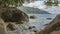 The waves of the ocean beat against huge picturesque boulders