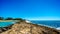 Waves of the Pacific Ocean crashing on the rocks on the shoreline of Ko Olina on the island of Oahu