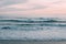 Waves in Pacific Ocean at sunset, in Newport Beach, Orange County, California