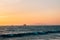 Waves in the Paciifc Ocean at sunset, in Huntington Beach, Orange County, California