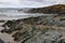 Waves pounding ocean rocks, in remote Arthur Pieman Conservation area, Tasmania West Coast