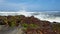 Waves pounding rocks on a beach