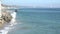 Waves pounding a rocky coastline in Malibu California