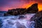 Waves and rocks in the Pacific Ocean at sunset, at Woods Cove