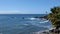 Waves rolling to shore in slow motion at a beautiful tropical resort coastline