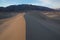 Waves of sand on top of the dunes. Sunrise. Desert in Mesquite F