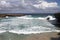 Waves shattering onto rocky Caribbean coast