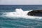 Waves shattering onto rocky Caribbean coast