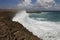 Waves shattering onto rocky Caribbean coast