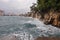 Waves splash on rock. Stormy sea on the beach.