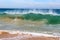 Waves splashing on basalt rocks at Ocean beach Bunbury Western Australia