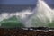 Waves splashing on basalt rocks at Ocean beach Bunbury Western Australia