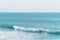 Waves and surfer in the Pacific Ocean, in Laguna Beach, Orange County, California