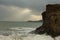 Waves sweeping against the rocks and sand of Carlyon bay in South Cornwall