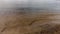 Waves of the Volga river, evenly hitting the sandy shore