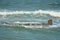 Waves washing over a rock shelf in the ocean