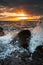 Waves Washing Over Rocks at Sunrise