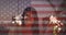 Waving american flag and constitution text against woman enjoying with sparklers at the beach