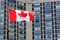 Waving canadian flag and building in the background