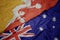 waving colorful flag of australia and national flag of bhutan