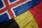 waving colorful flag of belgium and national flag of iceland