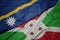 Waving colorful flag of burundi and national flag of Nauru