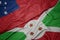 Waving colorful flag of burundi and national flag of Samoa