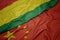 waving colorful flag of china and national flag of bolivia