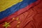 waving colorful flag of china and national flag of colombia