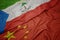 waving colorful flag of china and national flag of equatorial guinea