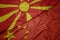 waving colorful flag of china and national flag of macedonia