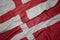 waving colorful flag of denmark and national flag of england