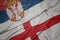 waving colorful flag of england and national flag of serbia