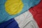 waving colorful flag of france and national flag of Palau