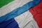 waving colorful flag of france and national flag of sierra leone