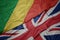 waving colorful flag of great britain and national flag of republic of the congo