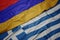 waving colorful flag of greece and national flag of armenia