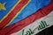 waving colorful flag of iraq and national flag of democratic republic of the congo