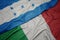 waving colorful flag of italy and national flag of honduras