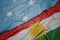 waving colorful flag of kurdistan and national flag of Federated States of Micronesia