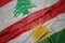 waving colorful flag of kurdistan and national flag of lebanon