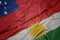 waving colorful flag of kurdistan and national flag of Samoa