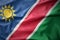 Waving colorful flag of namibia.