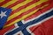 waving colorful flag of norway and national flag of catalonia