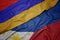 waving colorful flag of philippines and national flag of armenia