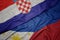 waving colorful flag of philippines and national flag of croatia