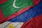 waving colorful flag of philippines and national flag of maldives