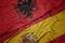 waving colorful flag of spain and national flag of albania