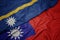 waving colorful flag of taiwan and national flag of Nauru